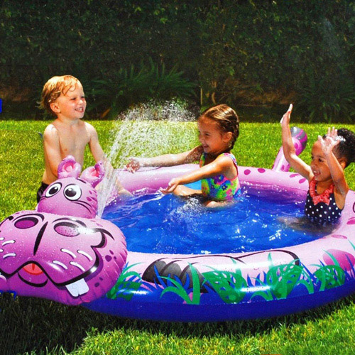 kids play in the pool with a fountain