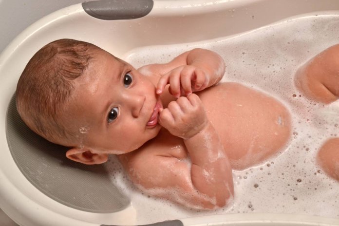 bathing baby with a slide