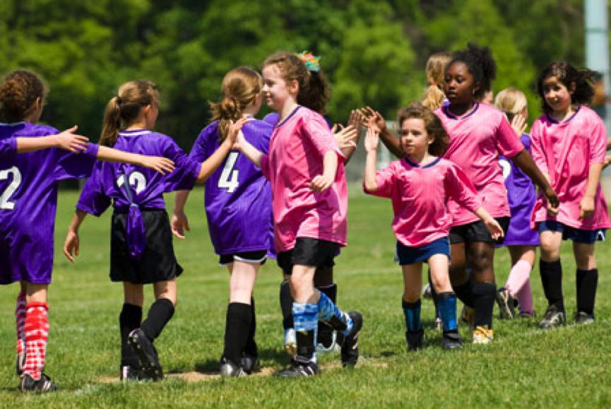 girls play soccer