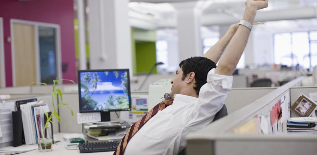 Man stretches at the table