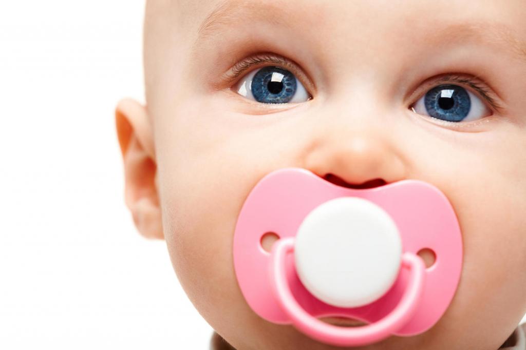 Baby with a pink pacifier