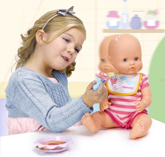 Girl playing with a doll