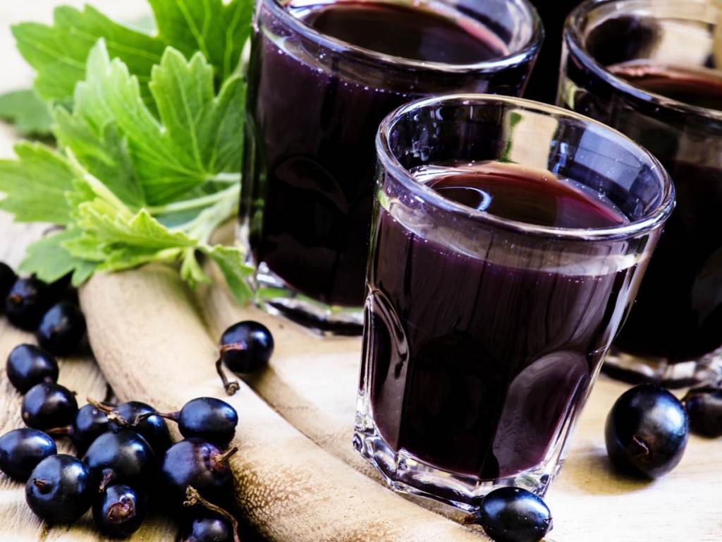 Blackcurrant liquor in shot glasses