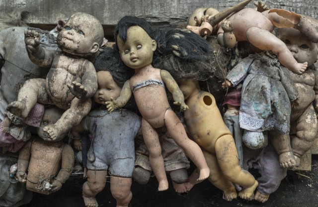 Group of dolls on the wall