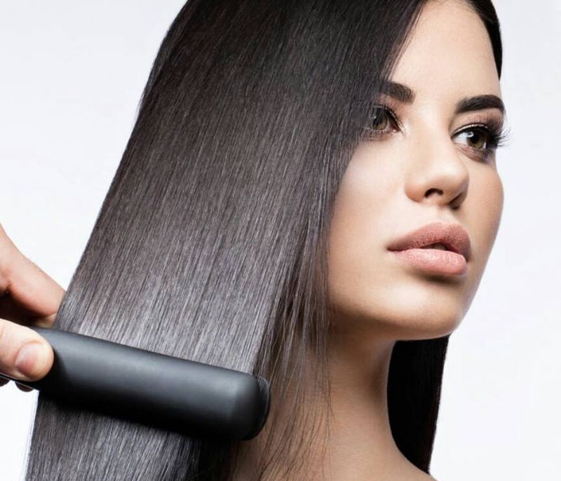 Hair straightening with an iron