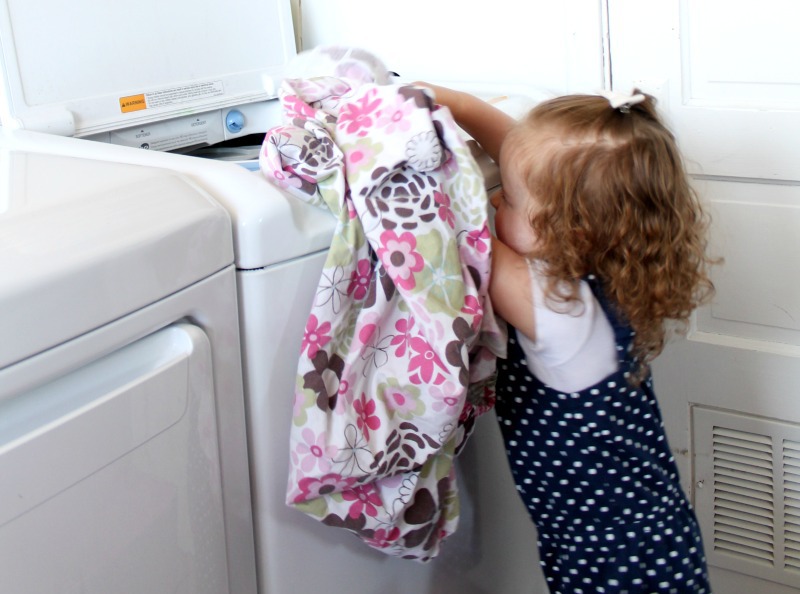 Helping mom with dirty clothes