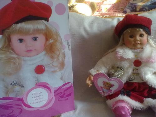 doll on the couch next to the box