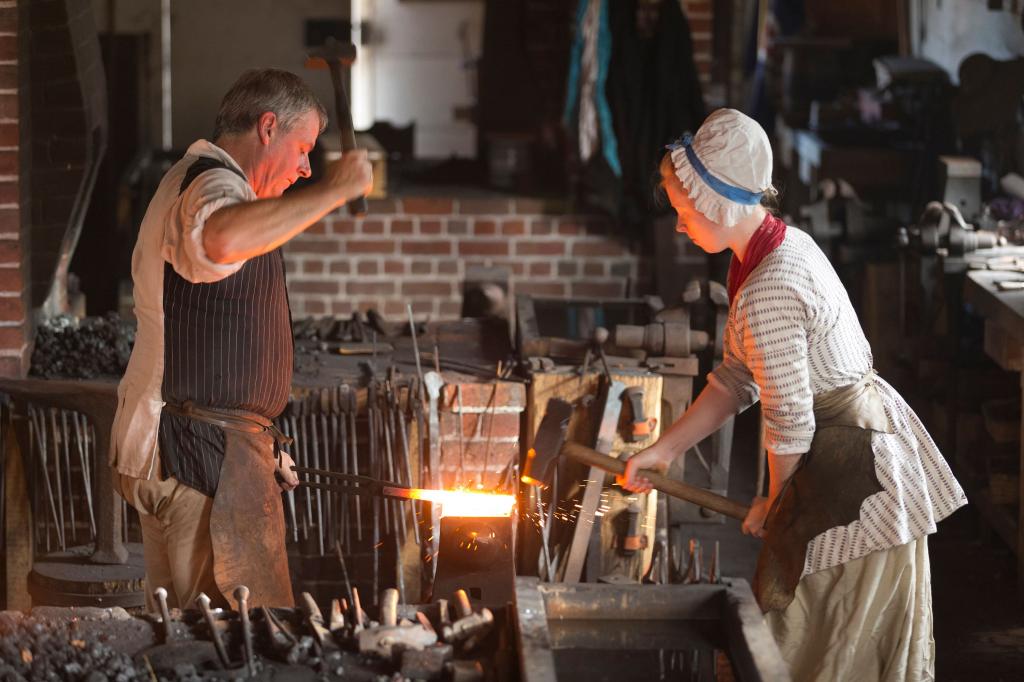 Blacksmith with assistant