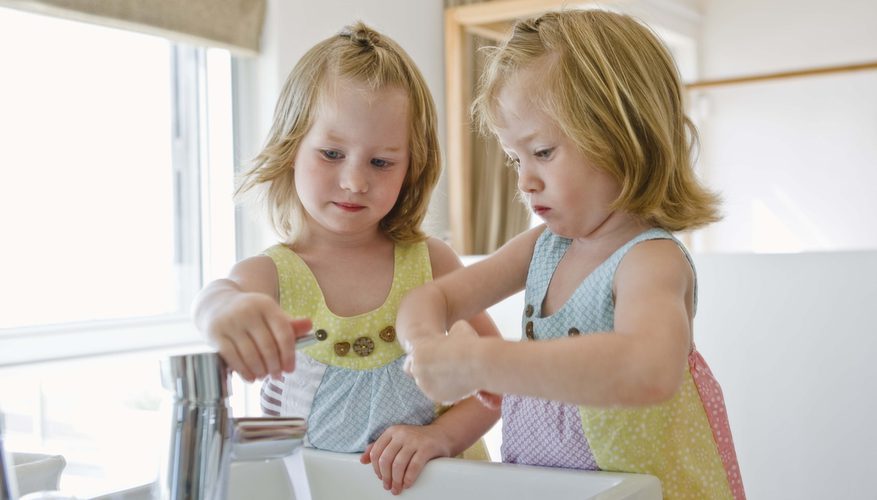 Two girls near the washbasin