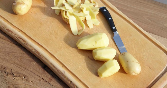 Peeling potatoes